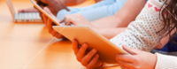 students-studying-in-classroom-with-digital-devices.png